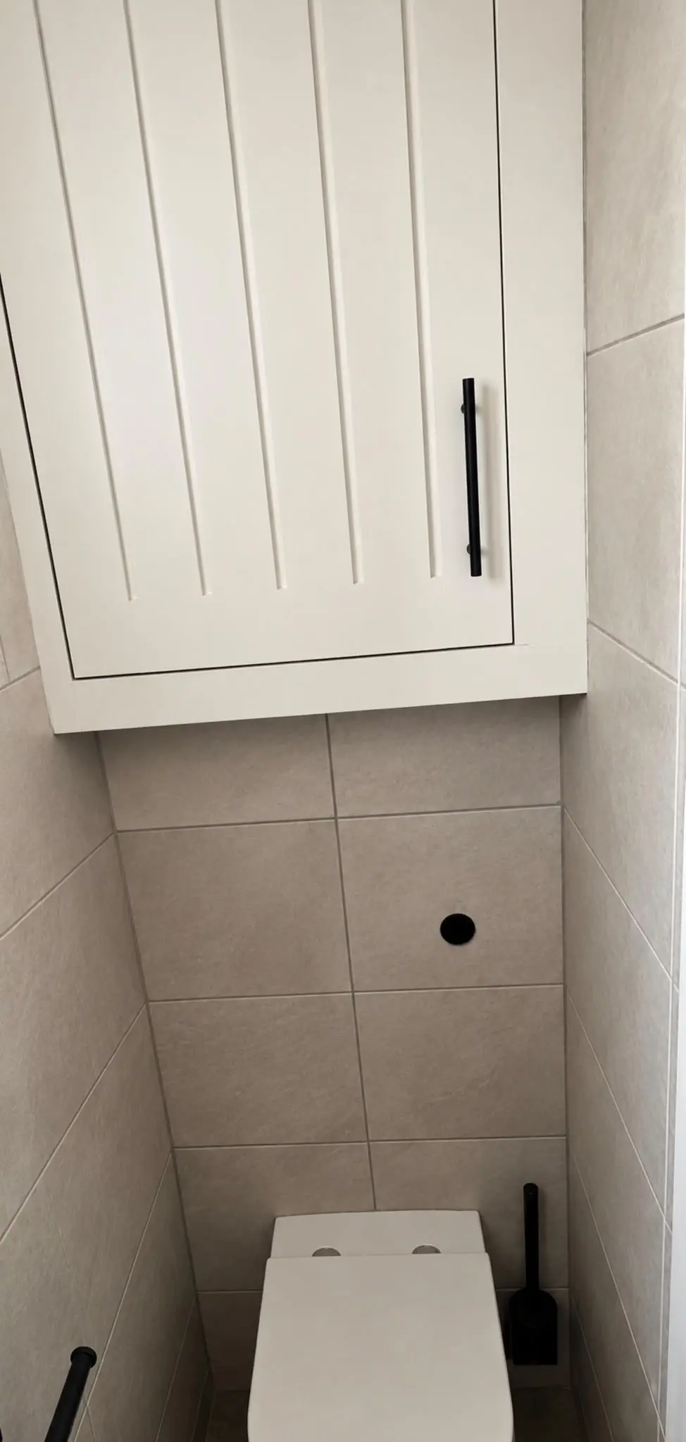 Farmhouse-style boiler cupboard with a black handle
