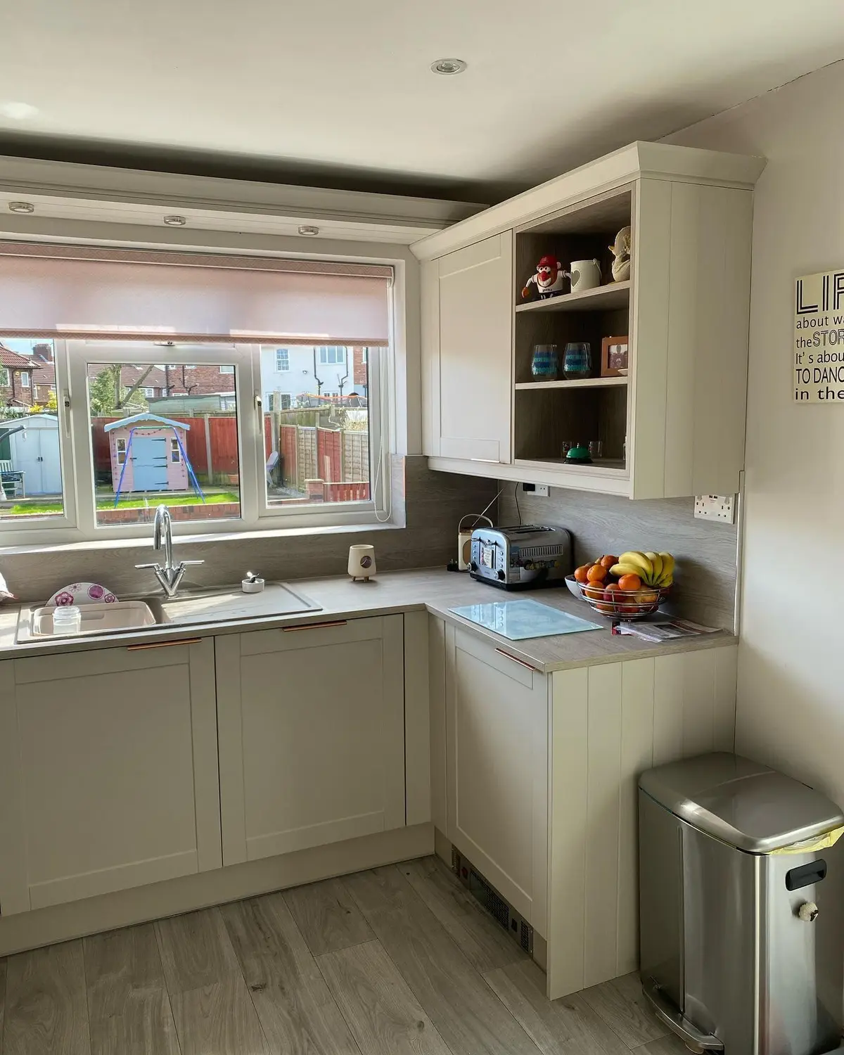 Light shaker kitchen run under the window