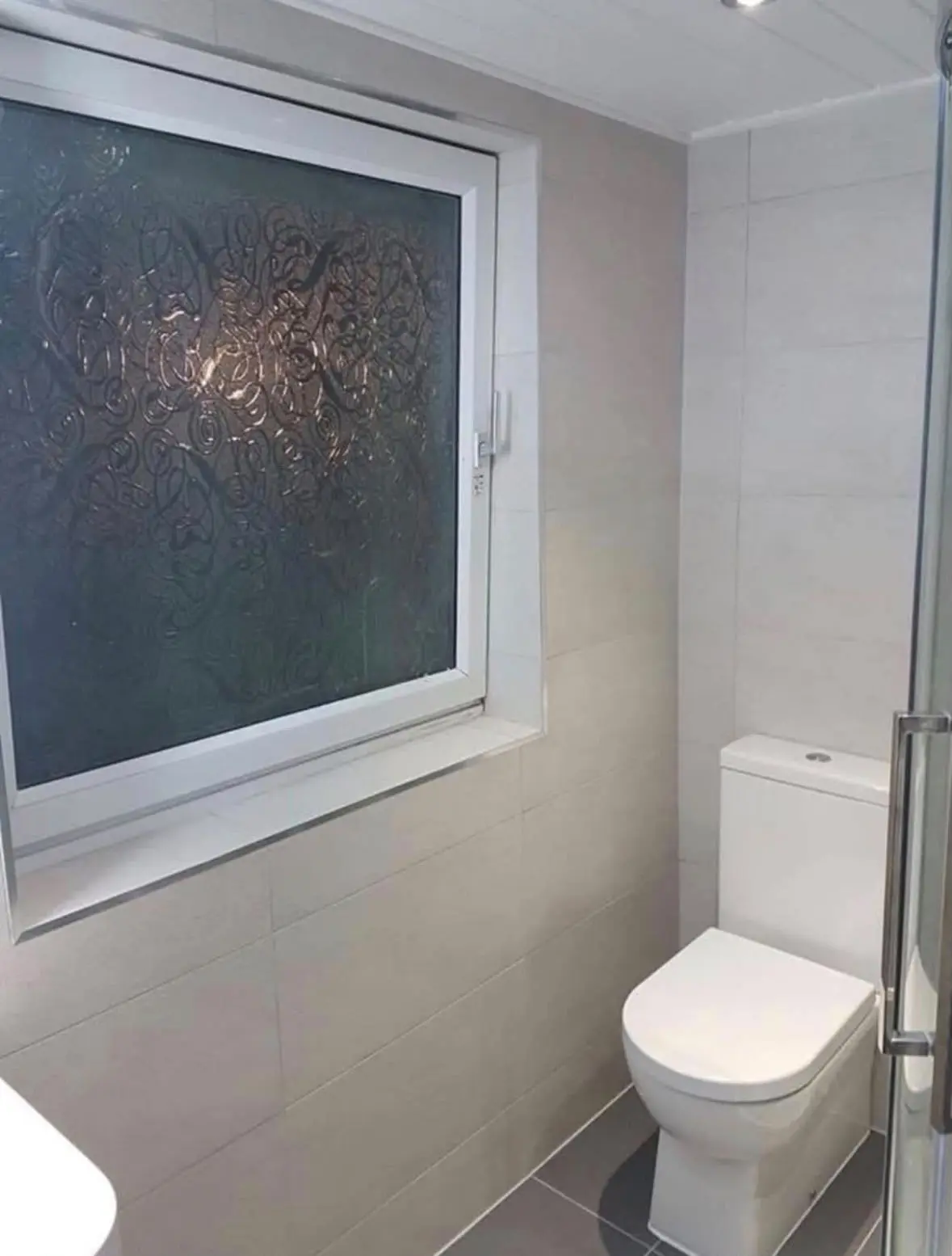 WC beneath an obscure-glazed window